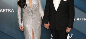Catherine Zeta-Jones and Michael Douglas holding hands.