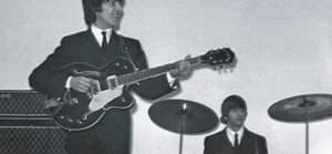 George Harrison playing guitar