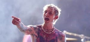 Machine Gun Kelly Tries to continue his Summer stage Central Park concert despite the officials turning off the sound system because of an approaching thunderstorm.