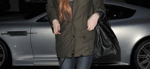 Lindsay Lohan leaves a friends house and heads to a friends house in West London to celebrate their birthday
