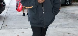 Kanye West is seen for the first time since becoming legally single as he hits up a tattoo shop in Miami