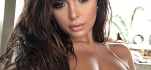 Demi Rose taking a selfie.