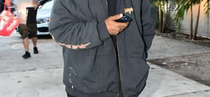 Kanye West is seen for the first time since becoming legally single as he hits up a tattoo shop in Miami