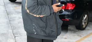 Kanye West is seen for the first time since becoming legally single as he hits up a tattoo shop in Miami