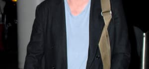 Matthew Perry shows off a fuller figure and double chin as he arrives at LAX airport