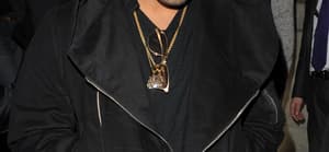 Drake leaving Aura nightclub The Canadian rapper wore a black hoodie grey jeans purple Timberland boots and a gold chain