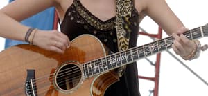 Taylor Swift performs live earlier in her career at KISS Country Chili Cookoff 2008 in Pembroke Pines Florida