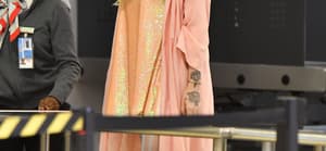 Kesha seen heading through security at LAX