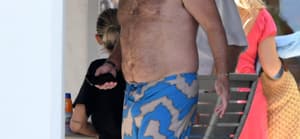 Vanderpump Rules star Lala Kent relaxes in black sweats while shirtless husband Randall Emmett takes a boat ride during their Miami vacation