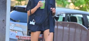 Kaia Gerber stops by a cafe for an iced Matcha while out with her dog