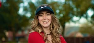 Grace Charis golfing in a red crop top on Valentine's Day