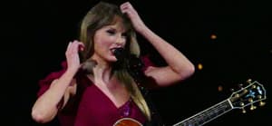 Taylor Swift has to fix her dress sleeve on opening night as her wardrobe falls apart during multimilion dollar tour in Arizona