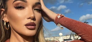 Beaux Raymond goes braless in her orange jumpsuit