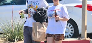 Kourtney Kardashian and husband Travis Barker are all smiles as they leave a vegan restaurant in Palm Desert after celebrating their 1st wedding anniversary