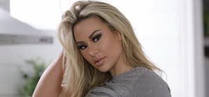 Kindly Myers in grey shirt and white thong