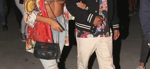 Singer Miguel and his girl at neon carnival
