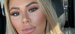 Kindly Myers sitting in traffic