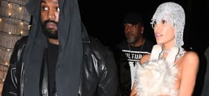 Kanye West's wife Bianca Censori is nearly naked in an X-rated silver string ensemble covering up with only a stuffed cat as the duo cause a stir at Miami's LIV nightclub.