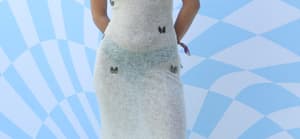 Tik Tok Star Charli D'Amelio in White Knit Dress with Butterfly Appliques and Heavy Boots at Revolve Festival In Palm Springs. 13 Apr 2024 Pictured: Tik Tok Star Charli D'Amelio in White Knit Dress and Heavy Boots at Revolve Festival. Photo credit: Tim Regas / MEGA TheMegaAgency.com +1 888 505 6342 (Mega Agency TagID: MEGA1123989_007.jpg) [Photo via Mega Agency]