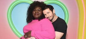 Gabby Sidibe's husband Brandon Frankel embraces her from behind.