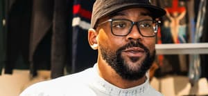 A portrait of Marcus Jordan wearing glasses