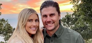 Christina Haack and Josh Hall posing together and smiling