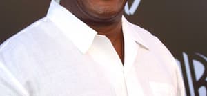 John Amos in white shirt