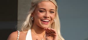 Olivia Dunne appears on a balcony at the home of Michael Rubin where he and Travis Scott are hosting the 4th July White party in Bridgehampton, New York. 04 Jul 2024 Pictured: Olivia Dunne,. Photo credit: MEGA TheMegaAgency.com +1 888 505 6342 (Mega Agency TagID: MEGA1162236_003.jpg) [Photo via Mega Agency]