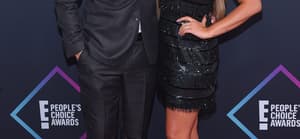Brittany Cartwright and Jax Taylor posing together on the red carpet.