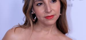 Lilliana Vazquez posing on the red carpet.