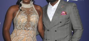 Wendy and Eddie Osefo posing on the red carpet.