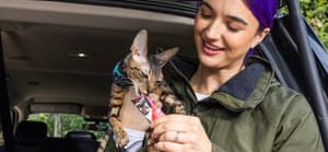 Brenna Huckaby feeding her cat