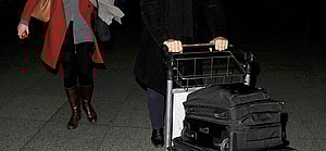 Stanley Tucci and his wife Felicity Blunt arriving into Heathrow Airport