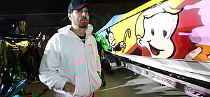 Scott Disick in white and baseball cap