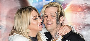 Melanie Martin and Aaron Carter smiling.