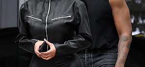 A newly single Kanye West is seen leaving his hotel with new girlfriend Chaney Jones in Miami