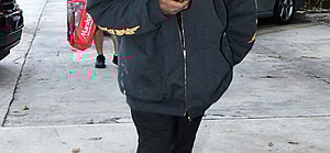 Kanye West is seen for the first time since becoming legally single as he hits up a tattoo shop in Miami