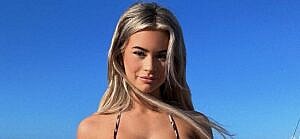 Emily Elizabeth posing for the camera in her bikini.