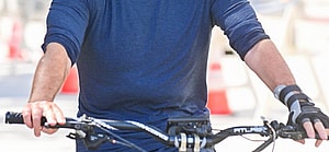 Fearless Simon Cowell hops back on a bike while still wearing a hand brace from a biking accident to film scenes for America apos s Go Talent