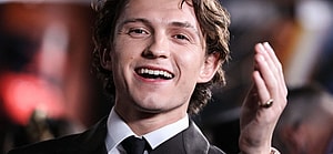 Tom Holland nearly bopped himself waving the chequered flag