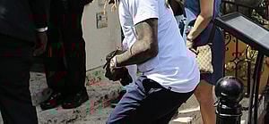 Rapper Lil Wayne sports yellow dreadlocks as he arrives to the wedding of rapper 2 Chainz