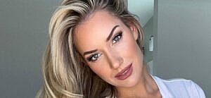 Paige Spiranac poses for the camera.