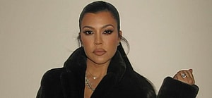 Kourtney Kardashian photographed wearing a black robe after the birth of son Rocky.