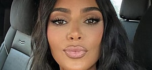 Kim Kardashian takes a selfie in the car.