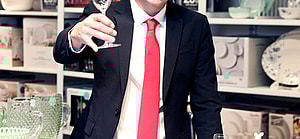 Wells Adams holding champange glass in JCPenney