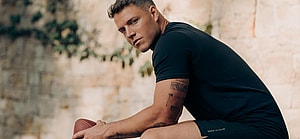 Christian McCaffrey holding a football