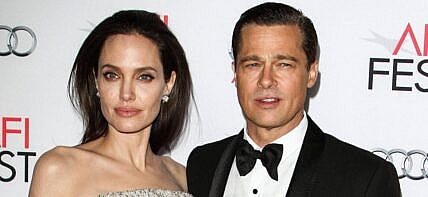 Angelina Jolie (wearing an Atelier Versace gown and Procop jewels) and Brad Pitt (wearing Lanvin) arrive at the opening night gala premiere of Universal Pictures' 'By the Sea' during AFI FEST 2015 presented by Audi held at the TCL Chinese Theatre IMAX on November 5, 2015 in Hollywood, Los Angeles, California, United States. 05 Nov 2015