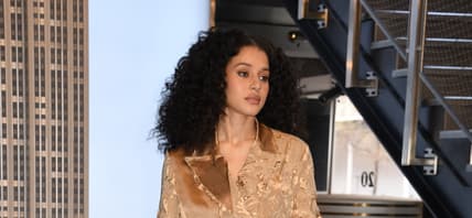 Chase Infiniti wearing a golden outfit