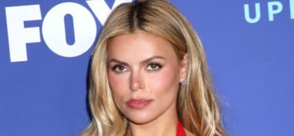 Brooks Nader in a red dress