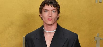 Connor Storrie in a suit